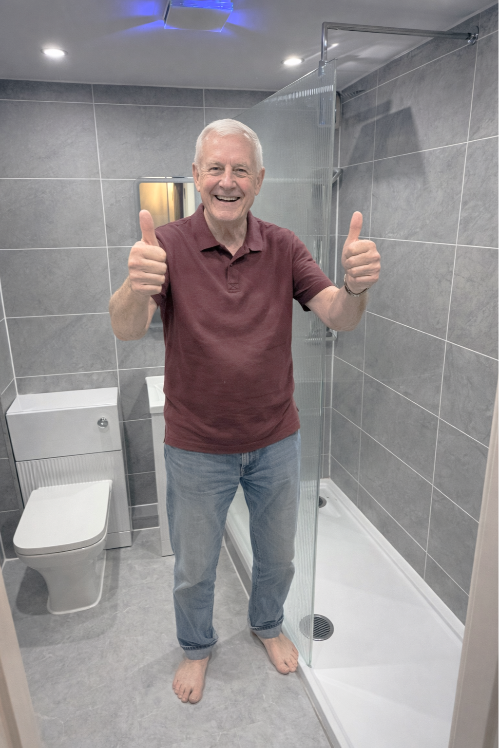 Delighted client showing finished bathroom renovation with clean modern design 